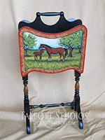 Vintage Magazine Stand with a hand painted scene of a mare and colt. The back side is handpainted to match the style of the front. Custom orders are gladly accepted.